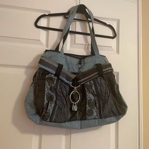 Denim look boho bag w/several pockets inside